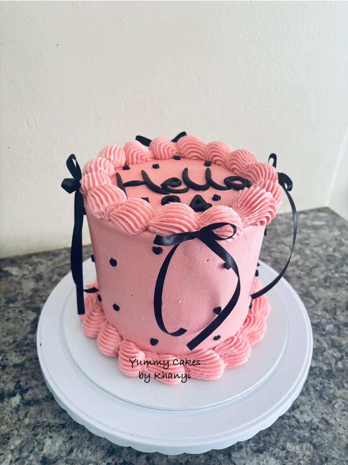Vibrant pink and black birthday cake