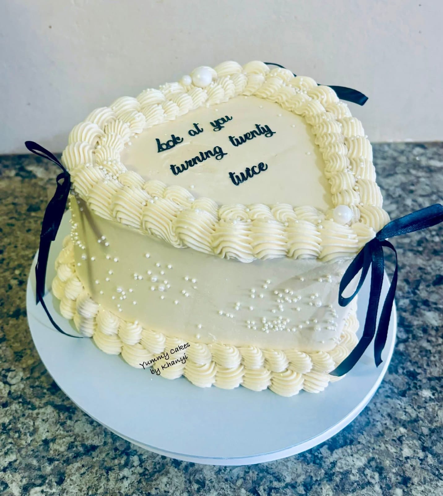 Stylized white and black accent birthday cake